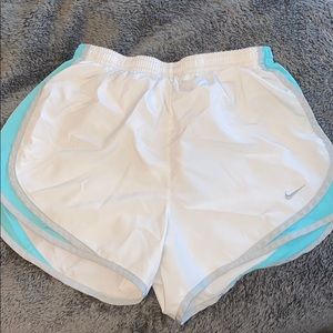 white and teal athletic shorts